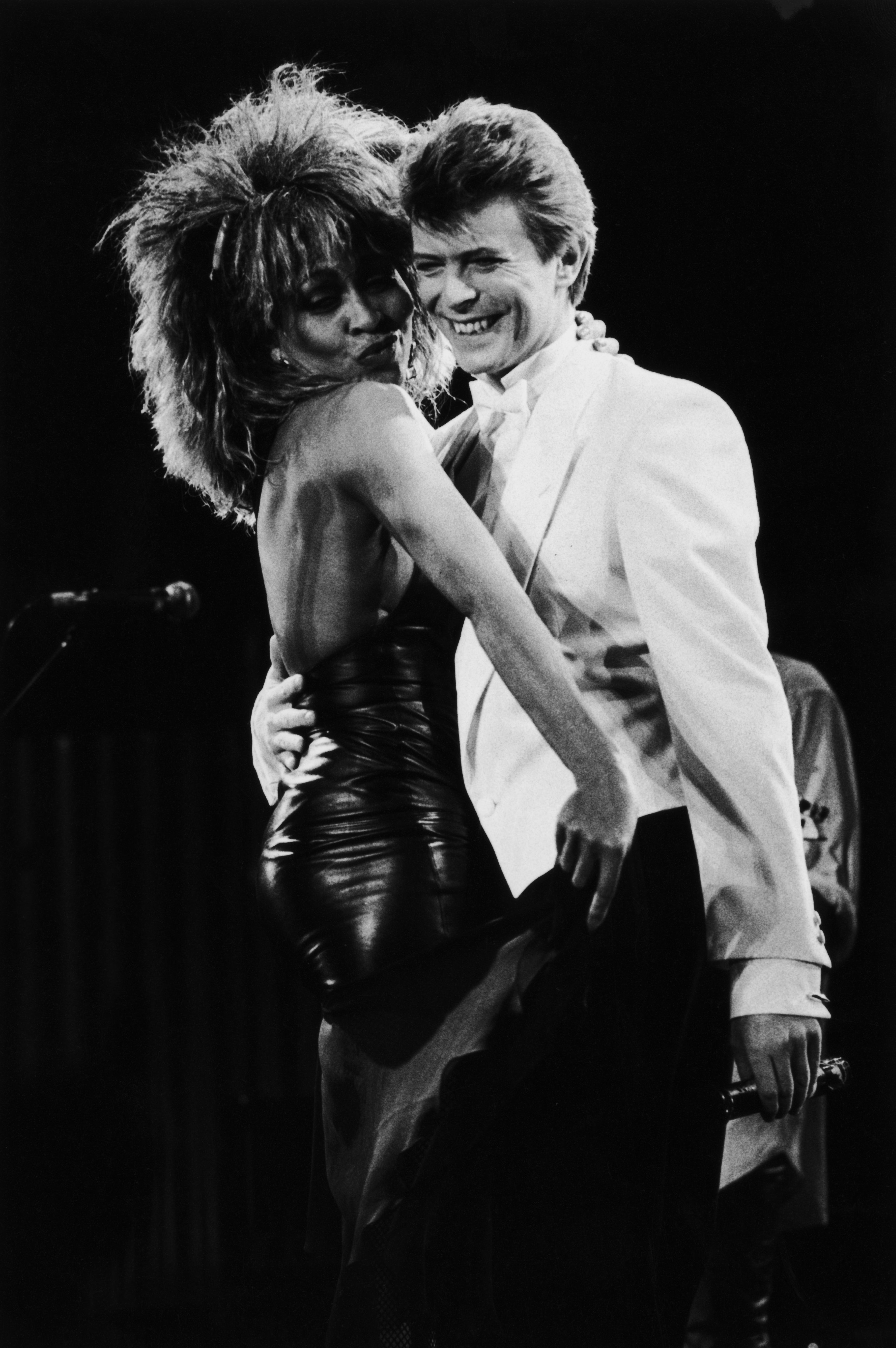 Singers David Bowie and Tina Turner perform on stage