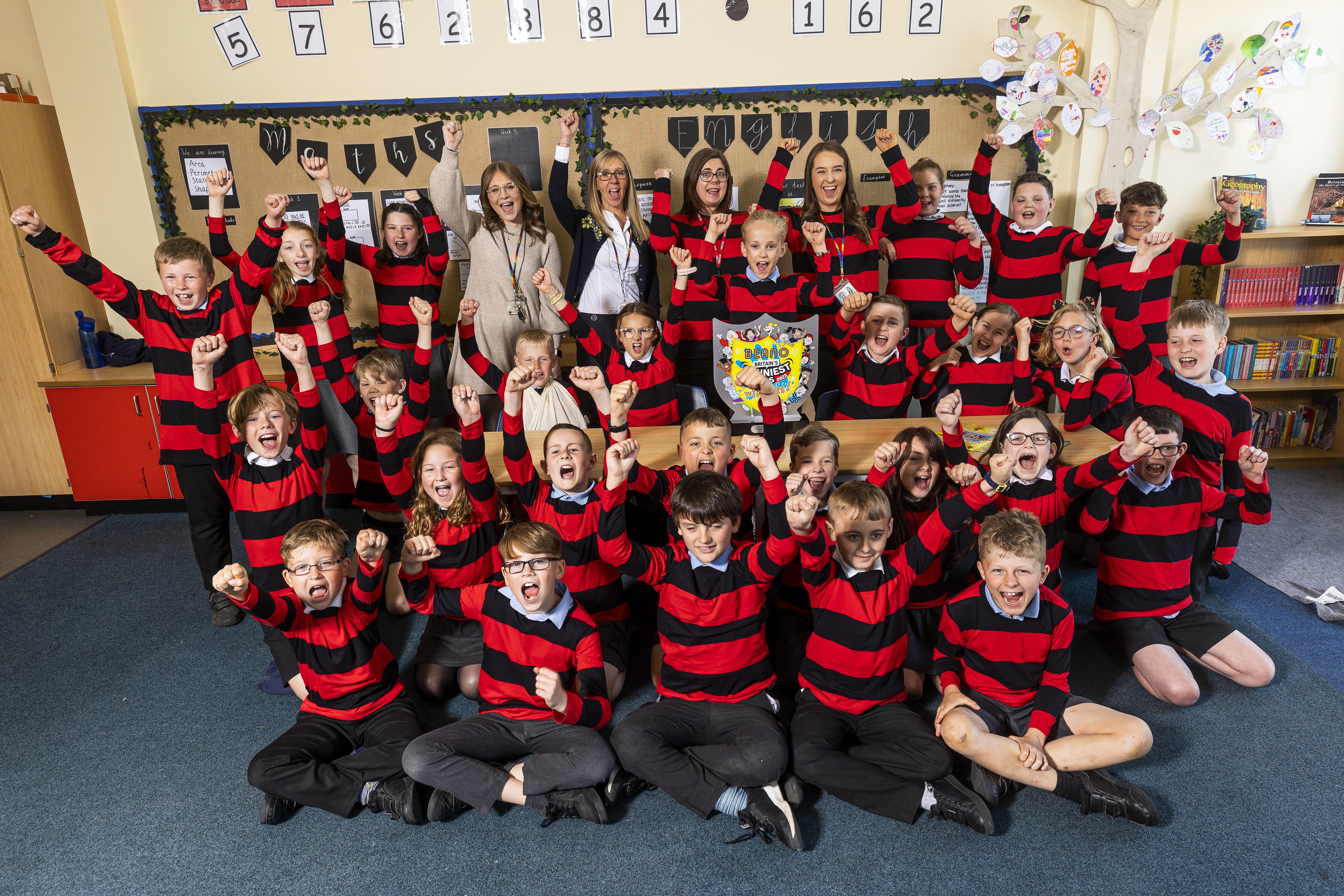 Students from Greasley Beauvale Primary School in Eastwood celebrate after being named the nation’s funniest class by Beano (PA Wire)