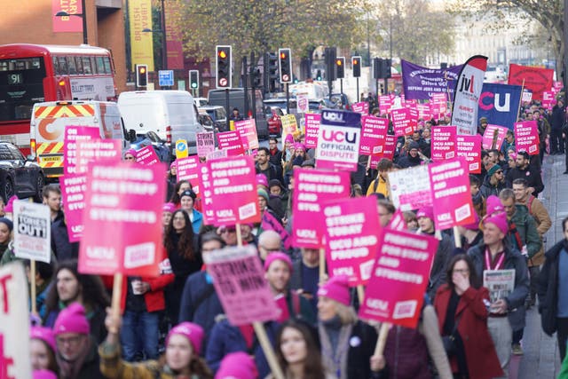 Protesters march along Euston Road near Kings Cross Station, London, during a rally as members of the University and College Union (UCU) take part 24-hour stoppage among university staff in an ongoing dispute over pay, pensions and conditions. Picture date: Wednesday November 30, 2022.
