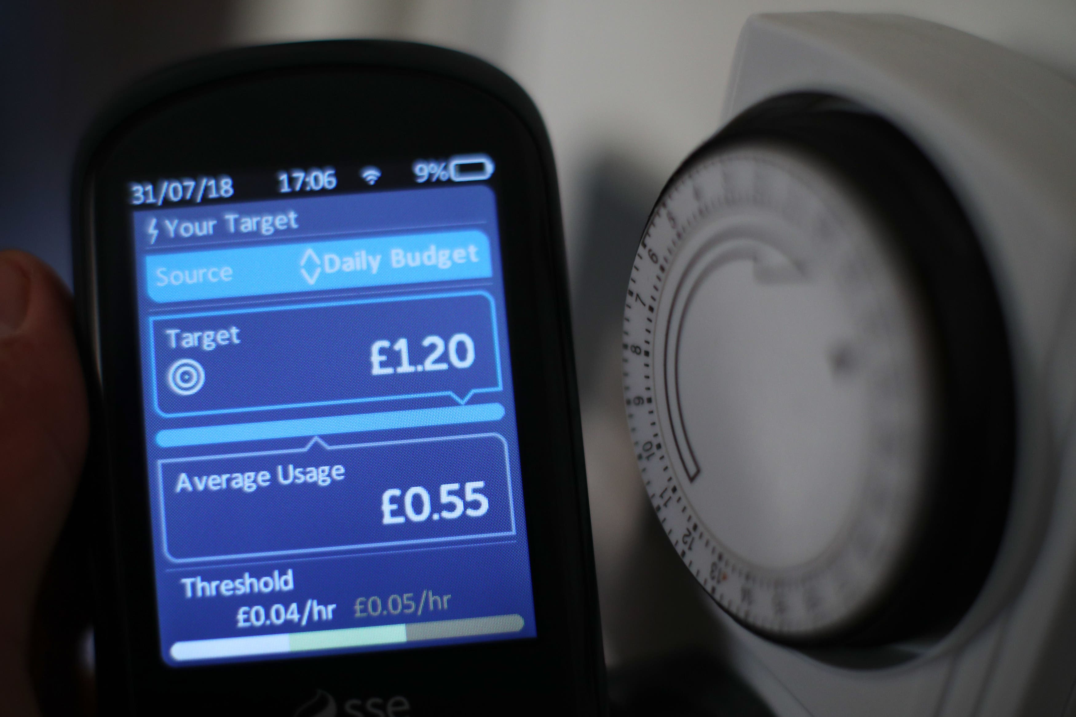 A handheld smart meter in a London home (PA)