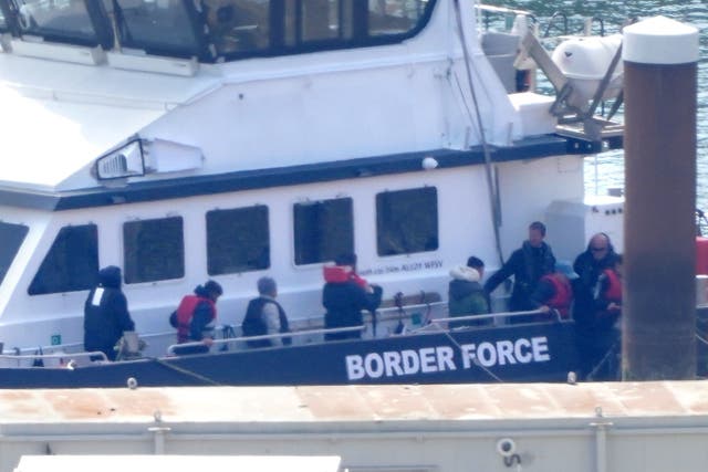 A group of people thought to be migrants are brought in to Dover, Kent, from a Border Force vessel (PA)