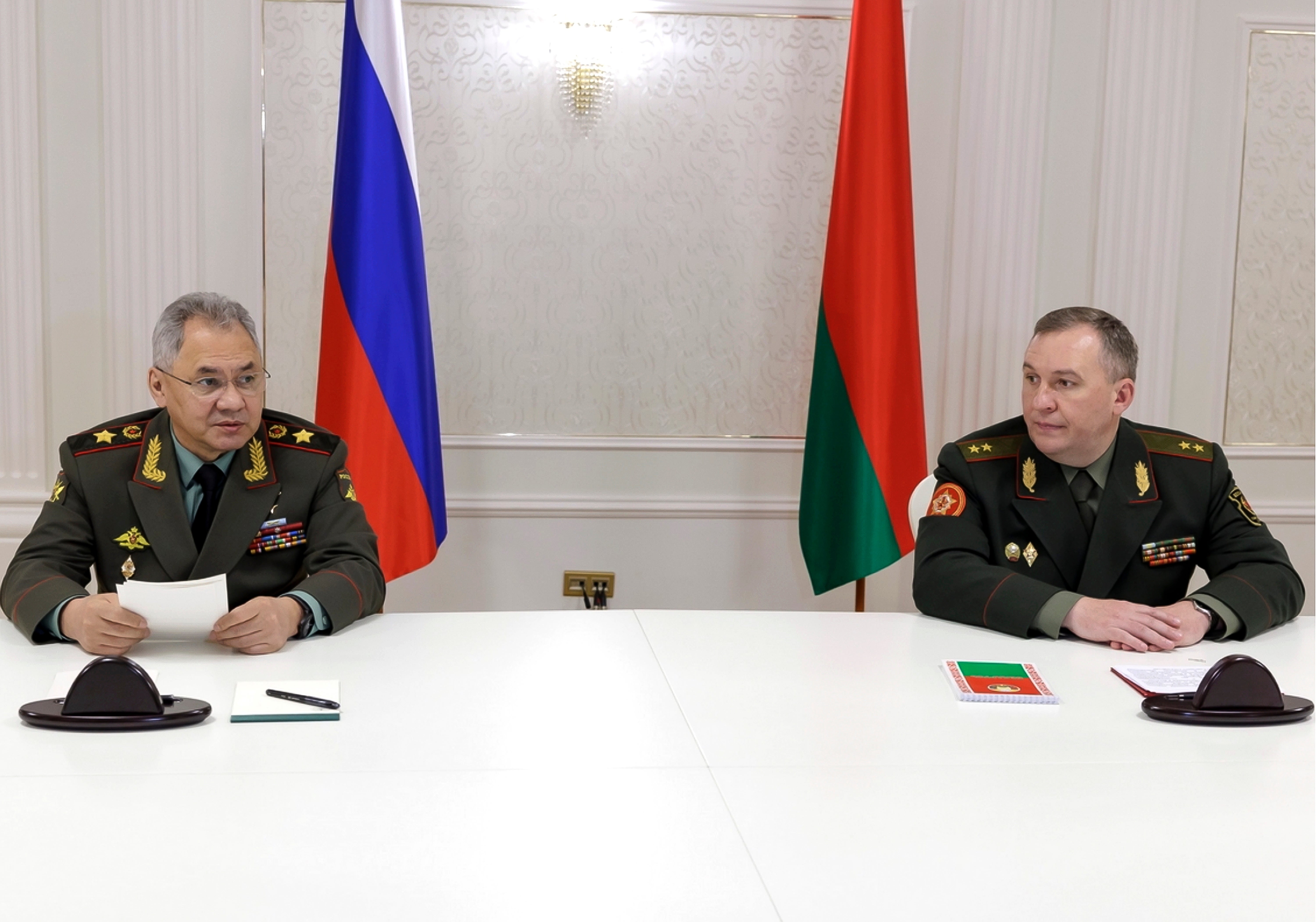Russian defence minister Sergei Shoigu, left, and Belarusian defence minister Viktor Khrenin, in Minsk on Thursday