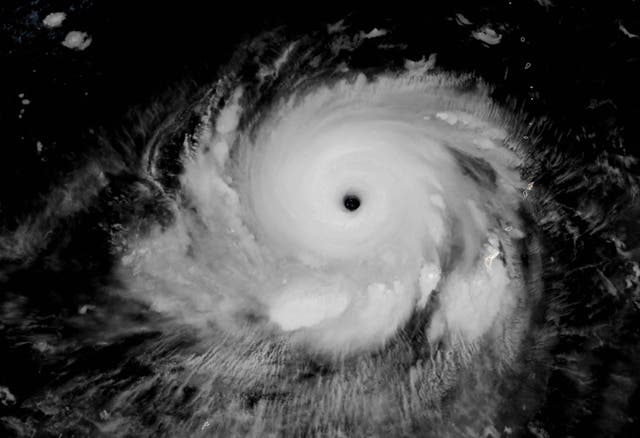 <p>'This satellite image obtained from the The National Oceanic and Atmospheric Administration shows Typhoon Mawar as it moves away from Guam </p>