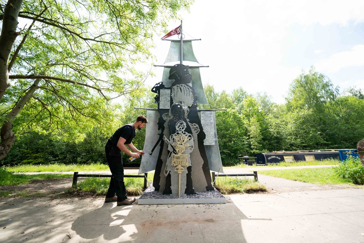 Artists defiant after black history sculpture defaced days after being unveiled