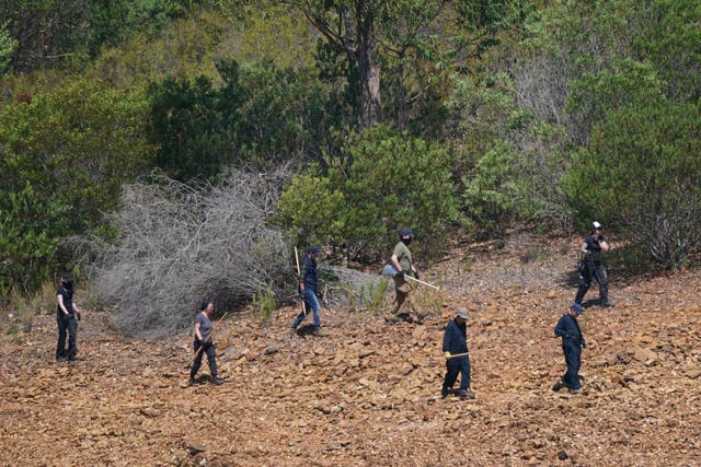 Personnel at Barragem do Arade reservoir, in the Algave, Portugal, as searches continue as part of the investigation into the disappearance of Madeleine McCann (Yui Mok/PA)