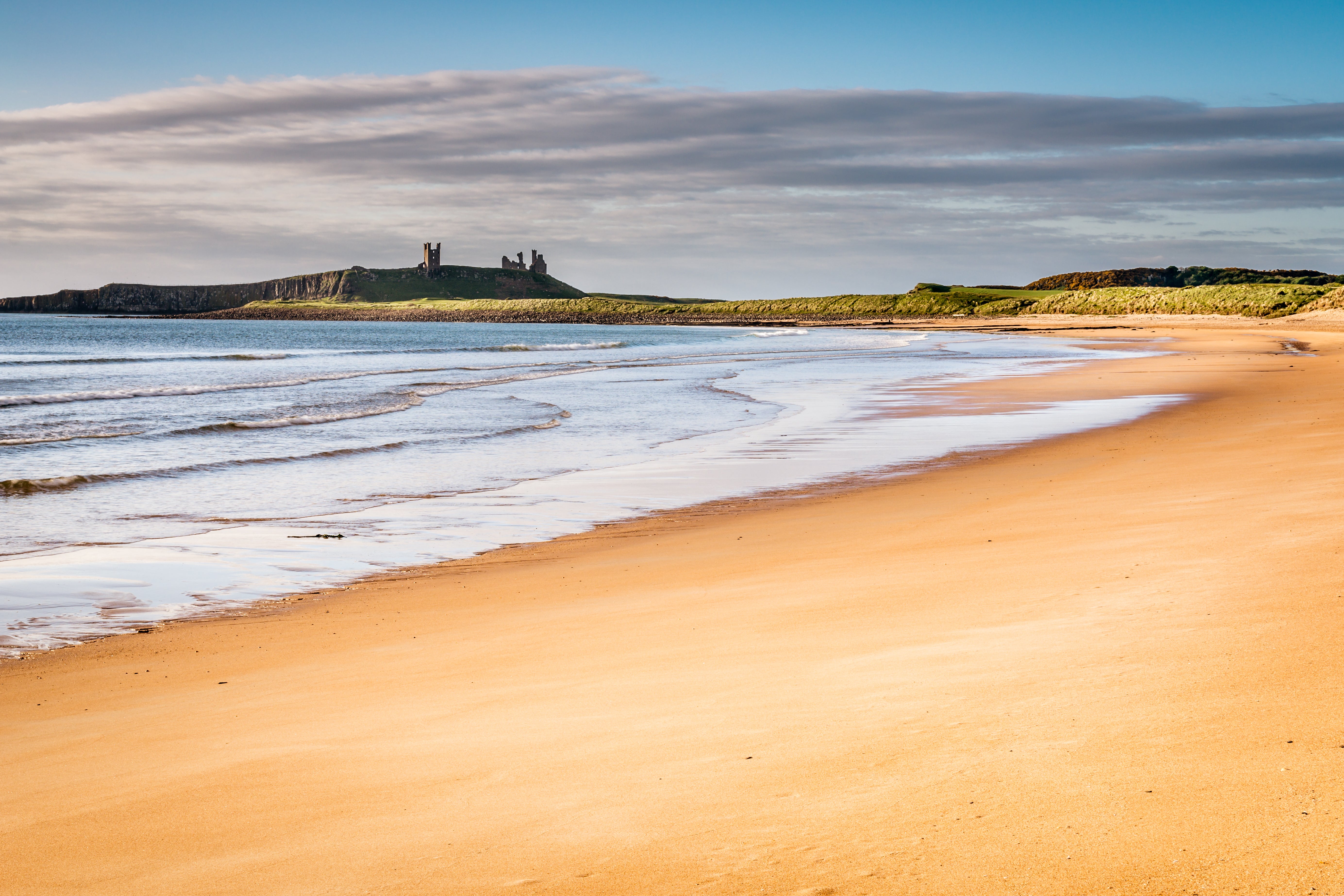Embleton Bay is overlooked by the ruins of Dunstanburgh Castle
