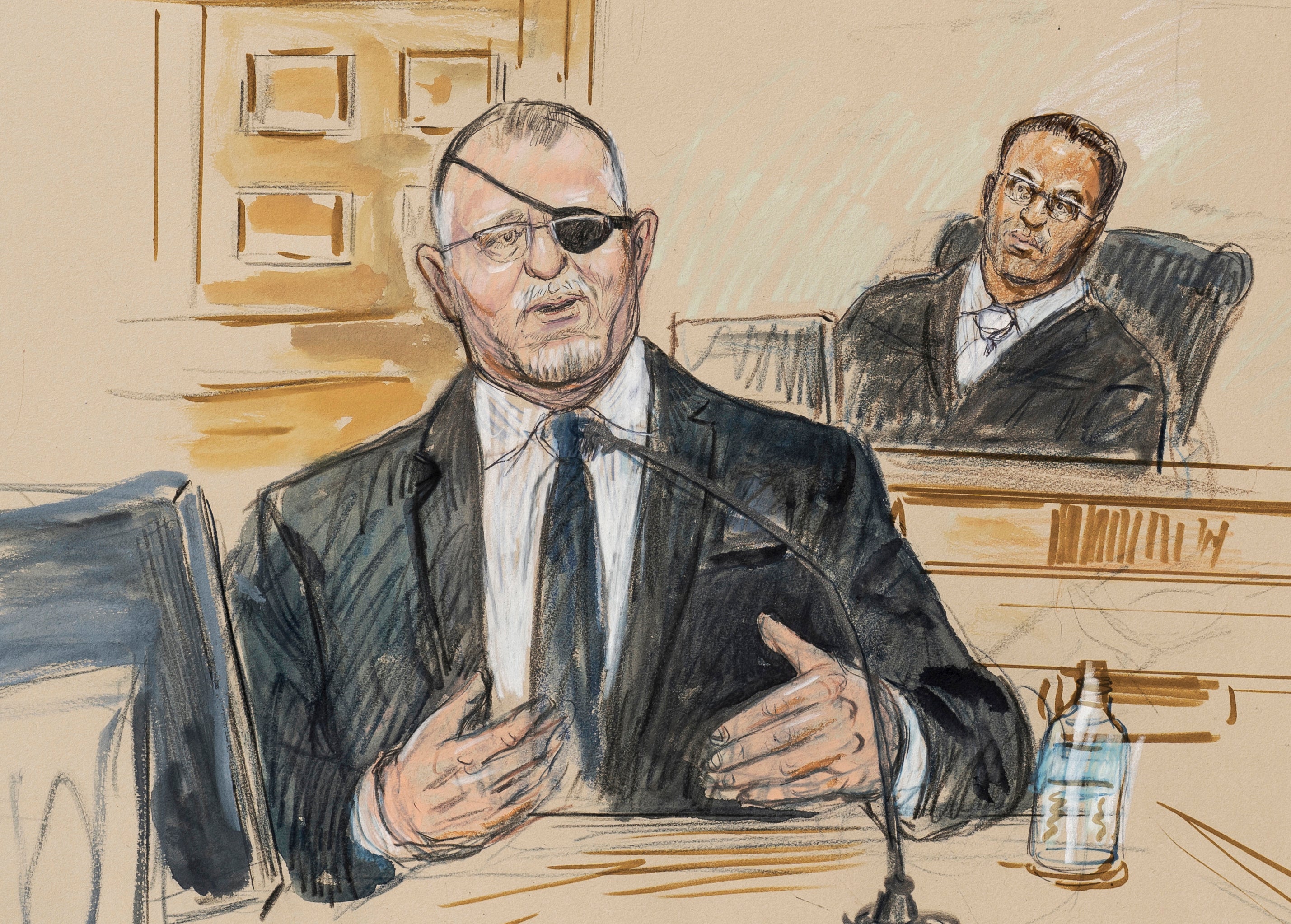 FILE - This artist sketch depicts the trial of Oath Keepers leader Stewart Rhodes, left, as he testifies before U.S. District Judge Amit Mehta on charges of seditious conspiracy in the Jan. 6, 2021, attack on the U.S. Capitol, in Washington, Nov. 7, 2022.