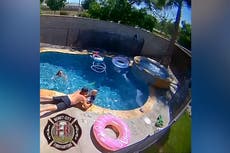 Moment firefighter saves one-year-old son from drowning