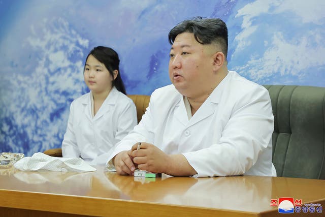 <p>North Korean leader Kim Jong-un, right, and his daughter, Kim Ju-ae, visit the country's aerospace agency on Tuesday </p>