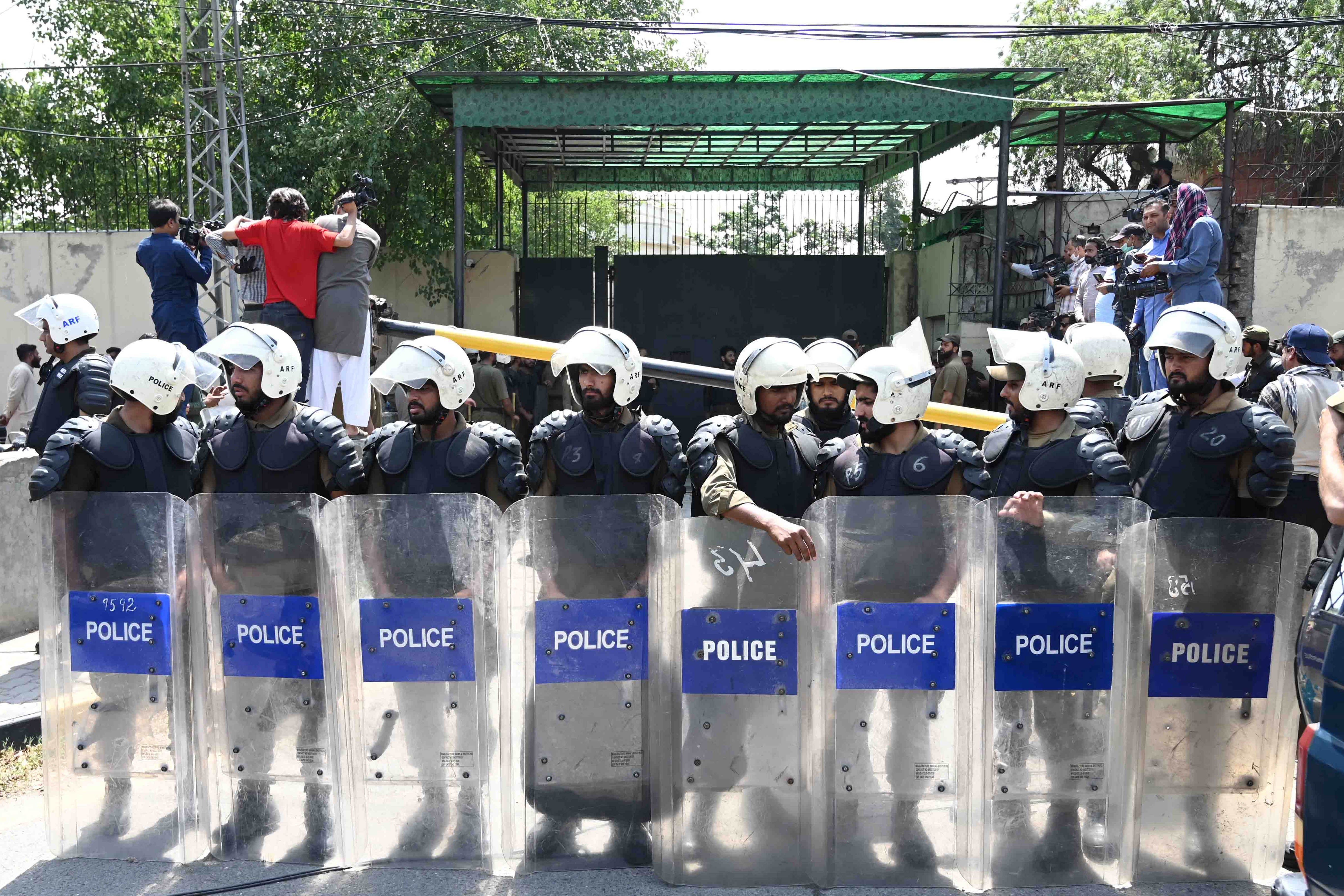 Pakistani security officials stand guard outside the Lahore high court where Imran Khan appeared for bail on 19 May