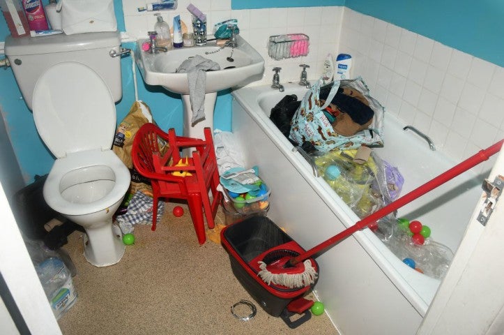 Other photographs shown to the jury reveal the filth and clutter in the couple’s house
