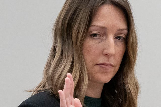<p>Dr Caitlin Bernard raises her right hand as she is sworn in Thursday, May 25, 2023, during a hearing in front of the state medical board at the Indiana Government South building in downtown Indianapolis. </p>