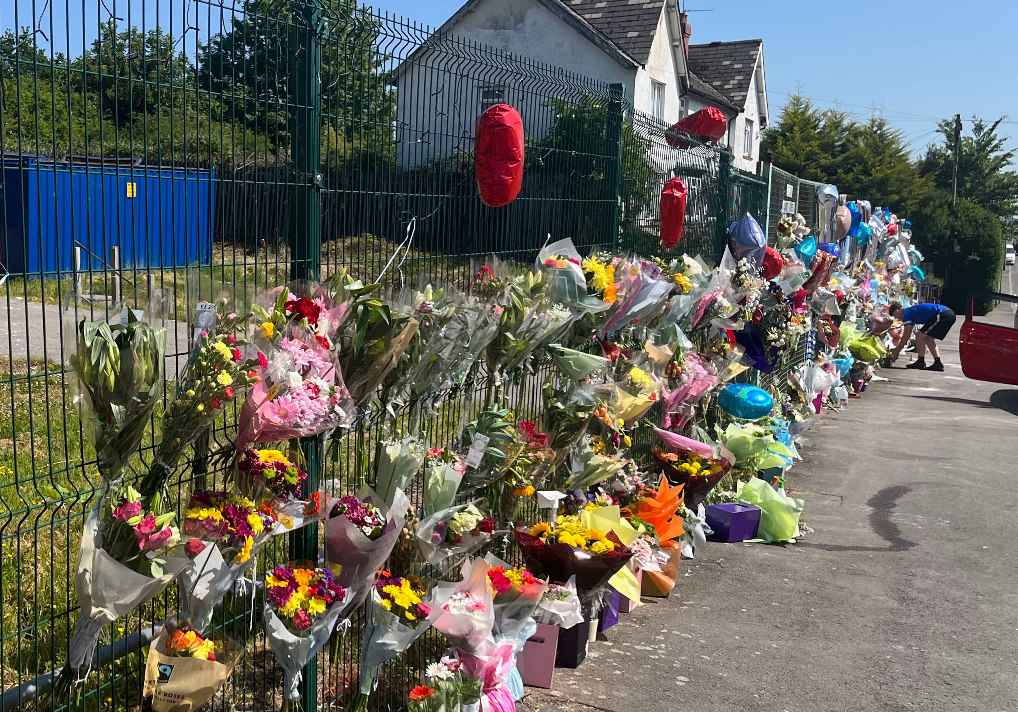 Floral tributes left to Kyrees and Harvey on Snowden Road