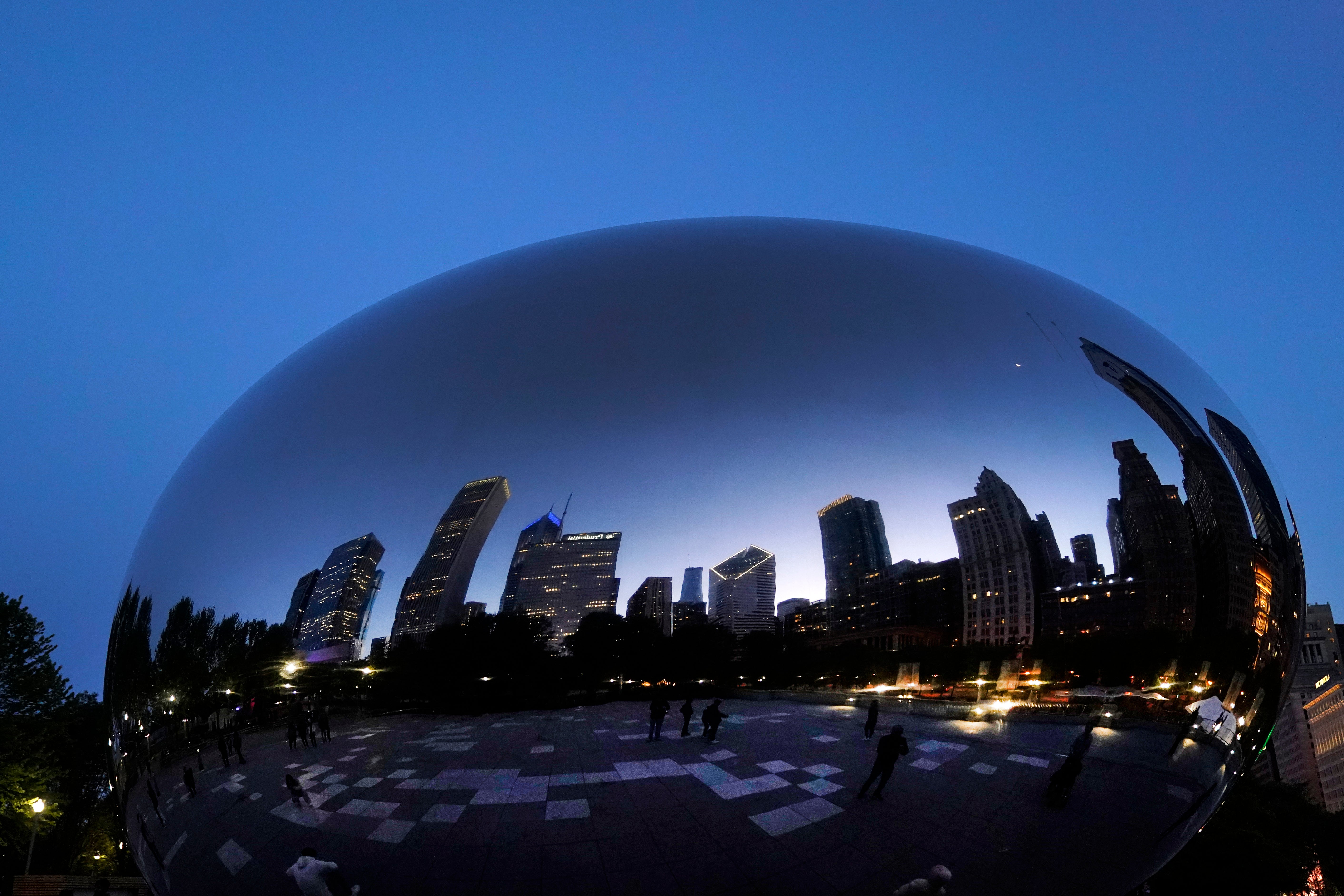 The Chicago skyline is reflected on Anish Kapoor’s stainless steel sculpture Cloud Gate, also known as ‘The Bean’