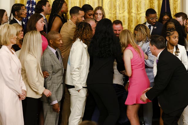 <p>Participants assist a player who passed out during an event for the Louisiana State University Tigers Women's Basketball team to celebrate their 2022-2023 NCAA Championship season, hosted in the East Room at the White House in Washington, DC, USA 26 May 2023. EPA/SAMUEL CORUM / POOL</p>