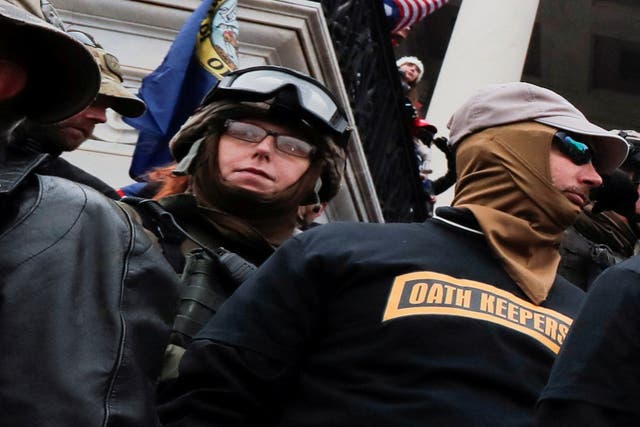 <p>Jessica Watkins, left, appears with members of the Oath Keepers on 6 January, 2021 at the US Capitol. </p>
