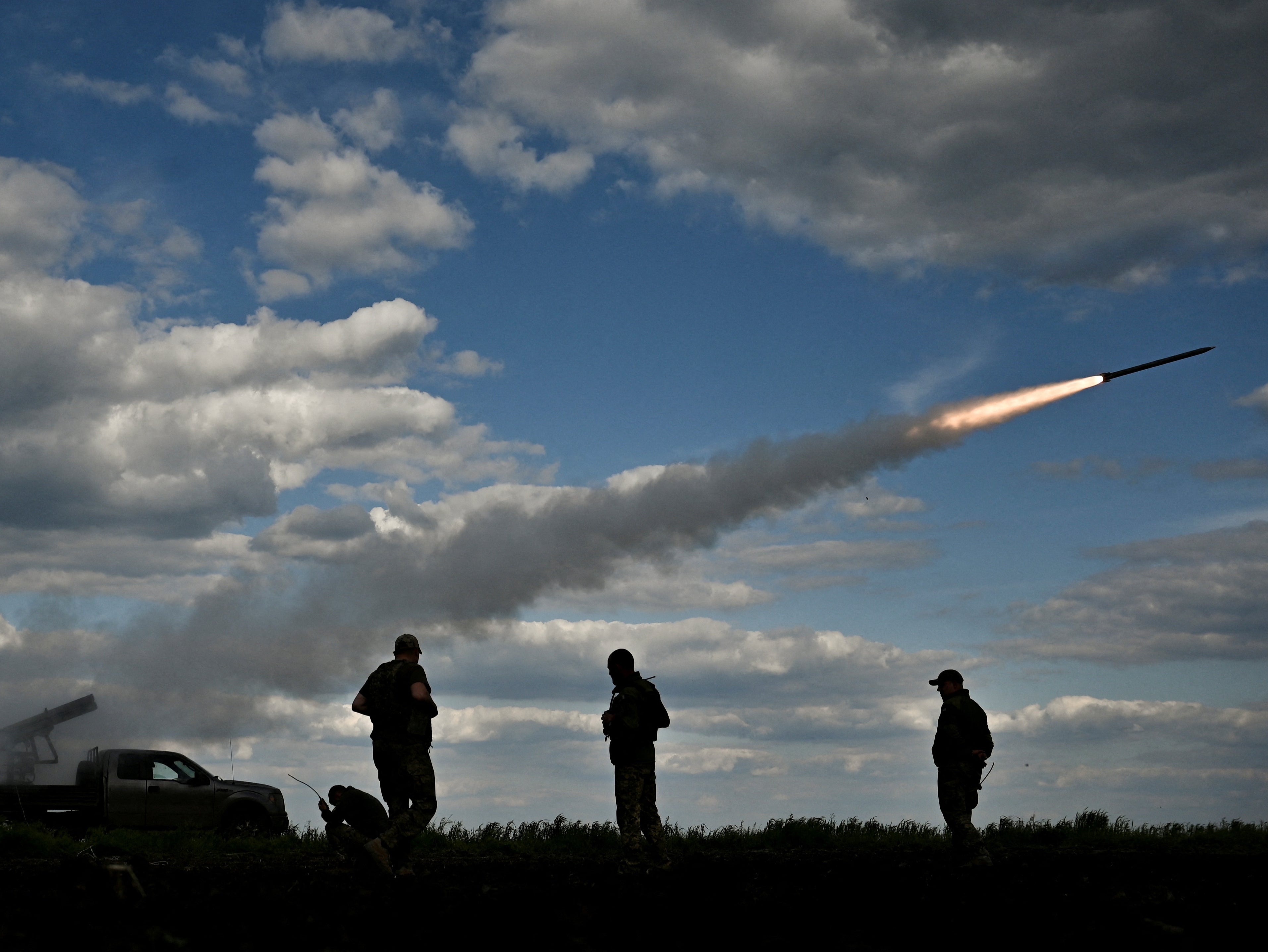 Ukrainian servicemen fire a Partyzan multiple launch rocket system towards Russian troops near a frontline in the Zaporizhia region last month