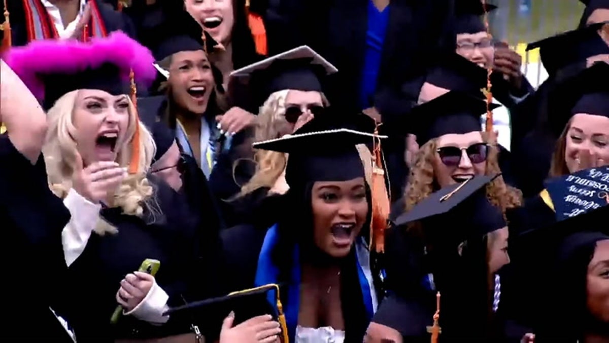 Moment billionaire surprises students with $1,000 cash each at graduation