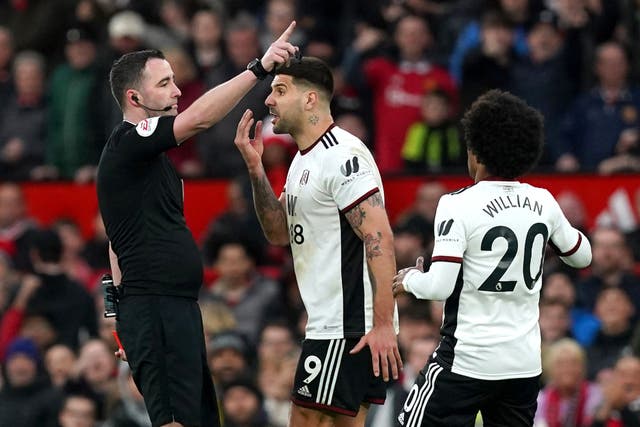 Aleksandar Mitrovic confronts referee Chris Kavanagh during Fulham’s FA Cup defeat at Manchester United in March (Martin Rickett/PA)
