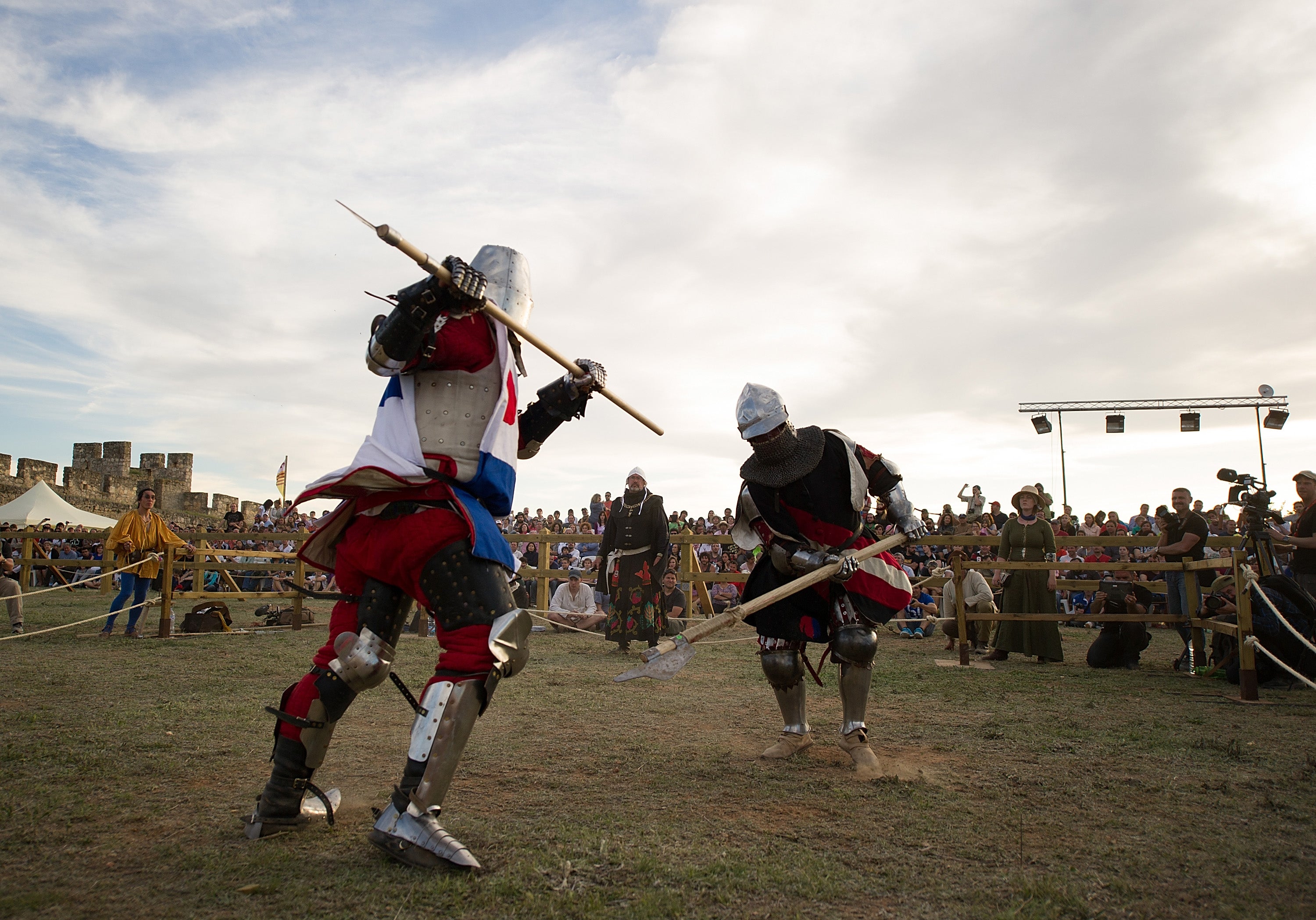 A knight from Japan (left) battles a knight from the US during the International Medieval Combat at Belmonte castle in Spain