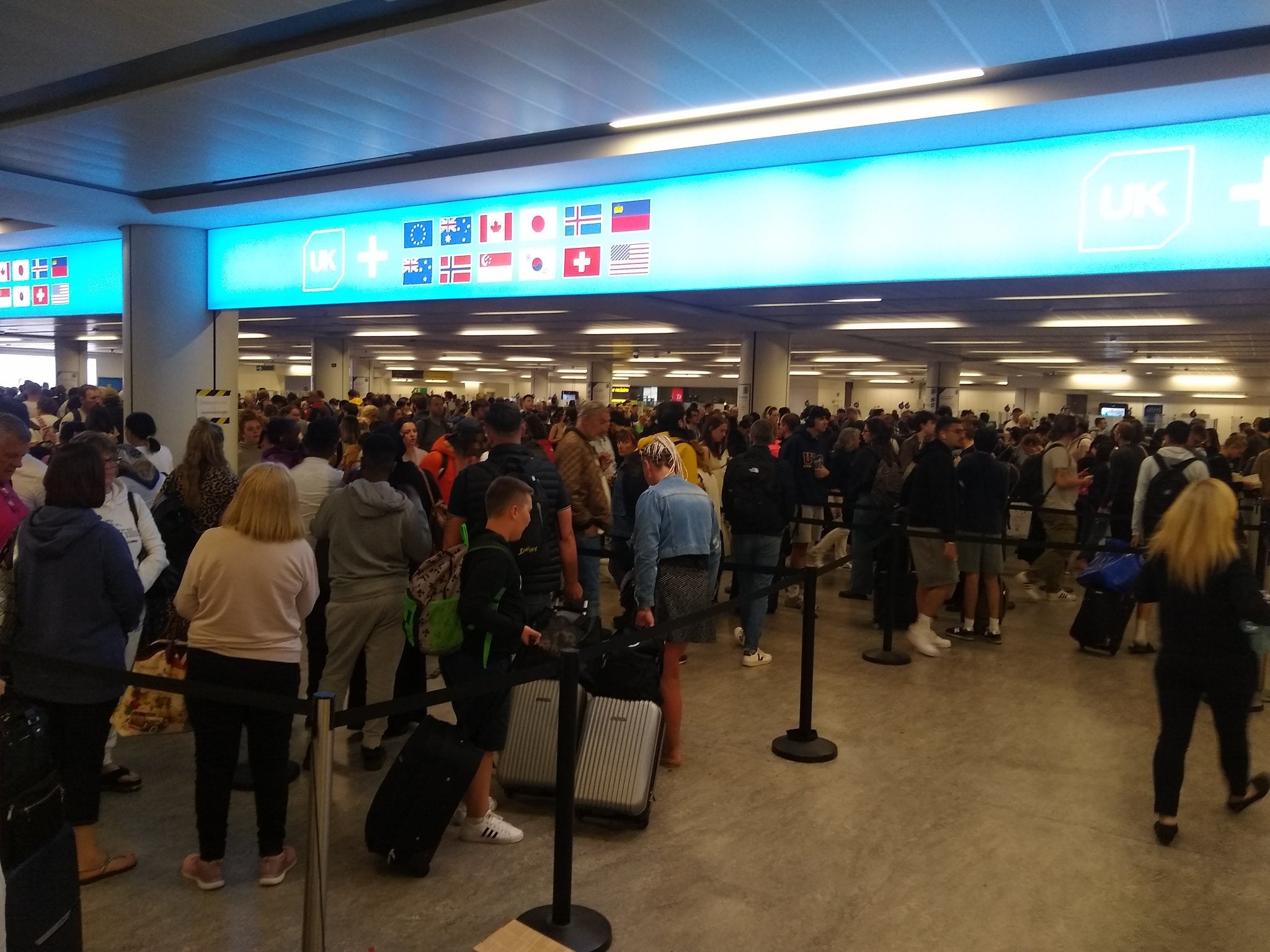 <p>Passengers are facing travel chaos as electronic passport gates have gone down across UK airports</p>