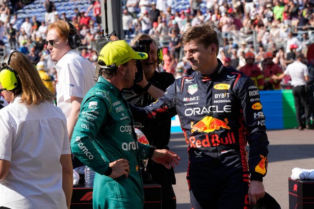 Fernando Alonso (left) spoke with Max Verstappen at the end of qualifying (Luca Bruno/AP)