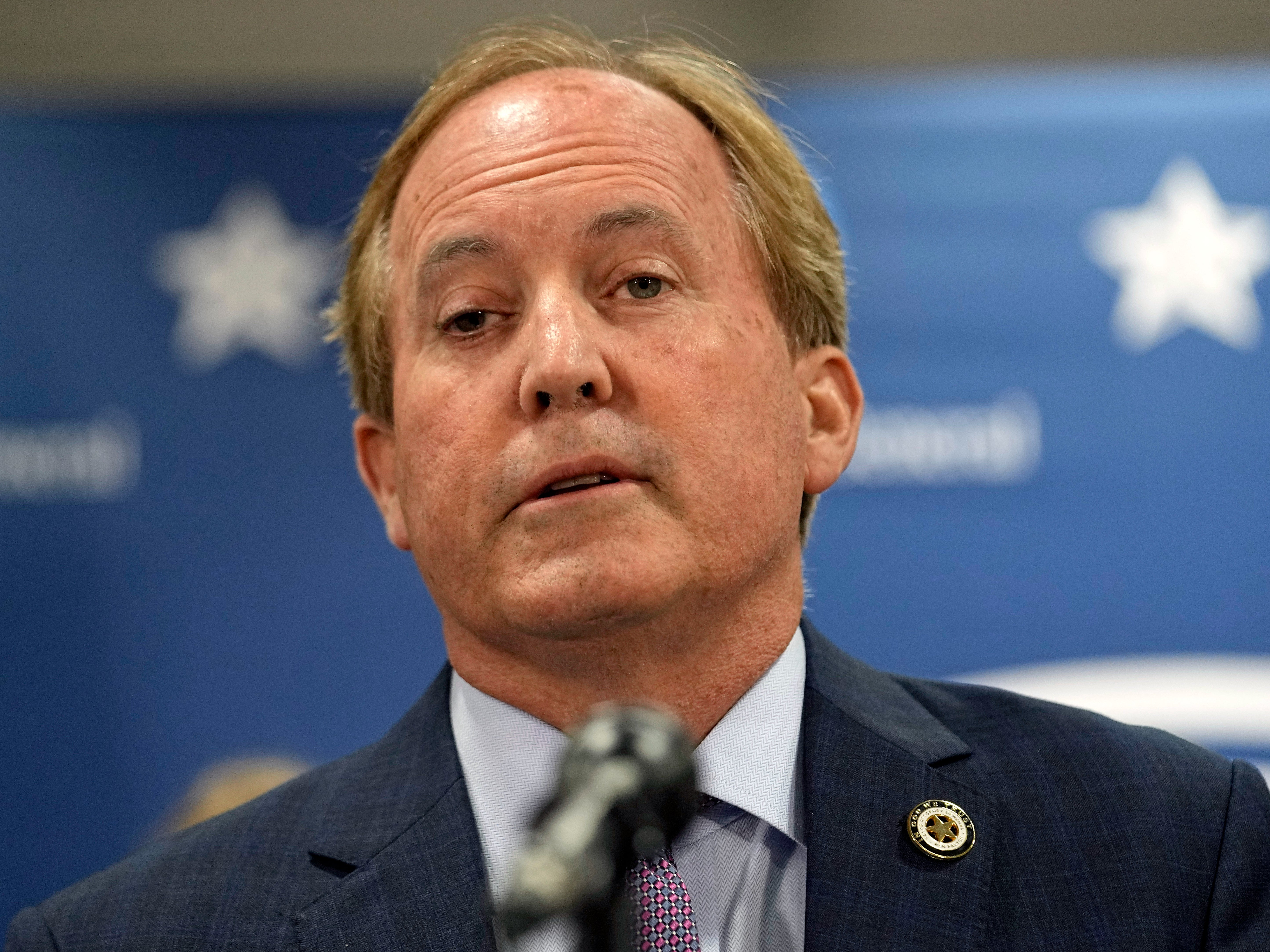 Texas state Attorney General Ken Paxton reads a statement at his office in Austin, Texas, Friday, May 26, 2023