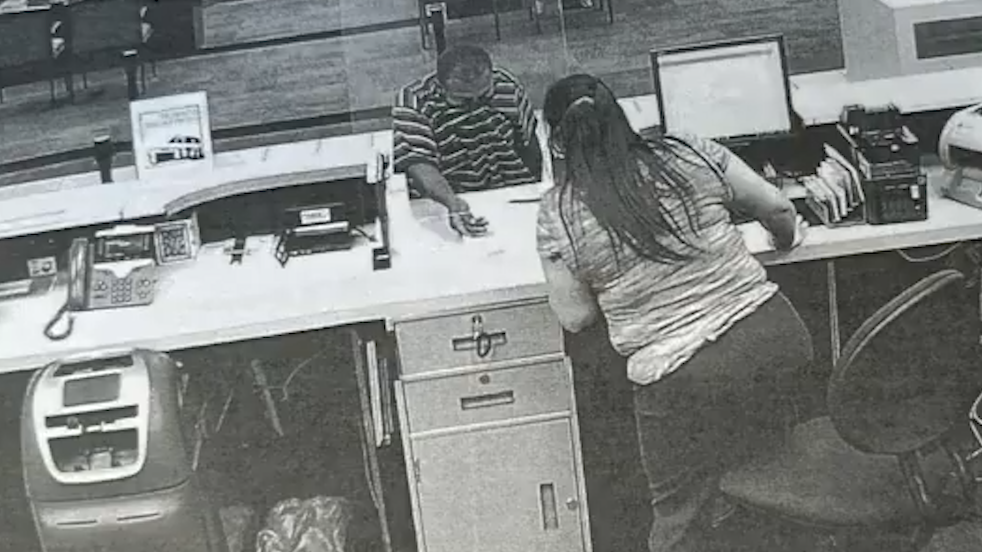 <p>Mind-boggling moment passerby stops bank robbery by giving suspect a hug</p>