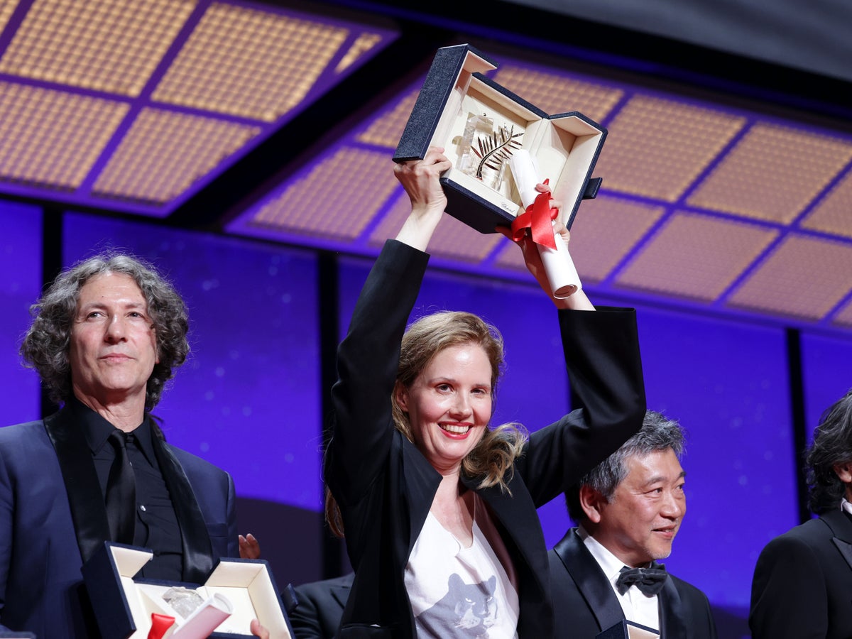 Justine Triet criticises French president Macron as she becomes third woman to win Cannes Palme d’Or