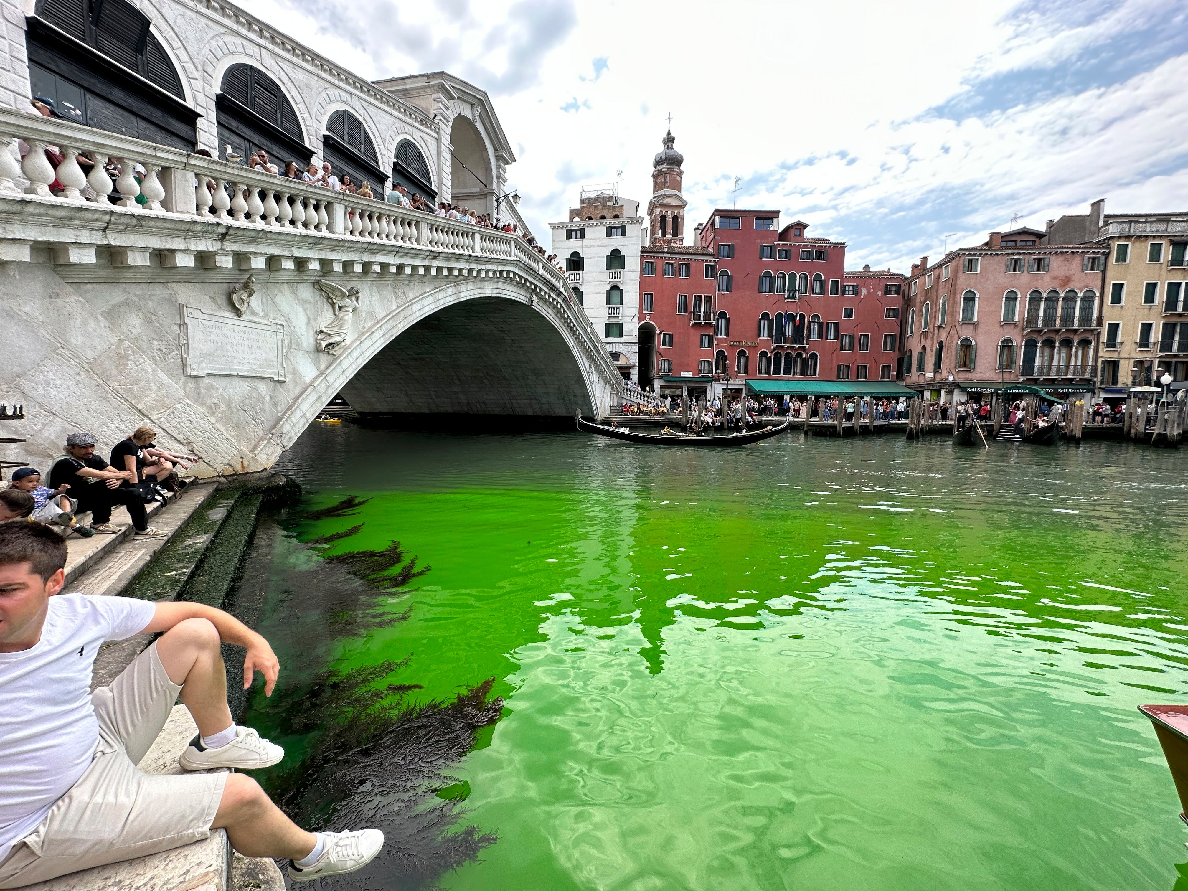 Venice’s Grand Canal was turned a bright green by the chemical fluorescein on Sunday