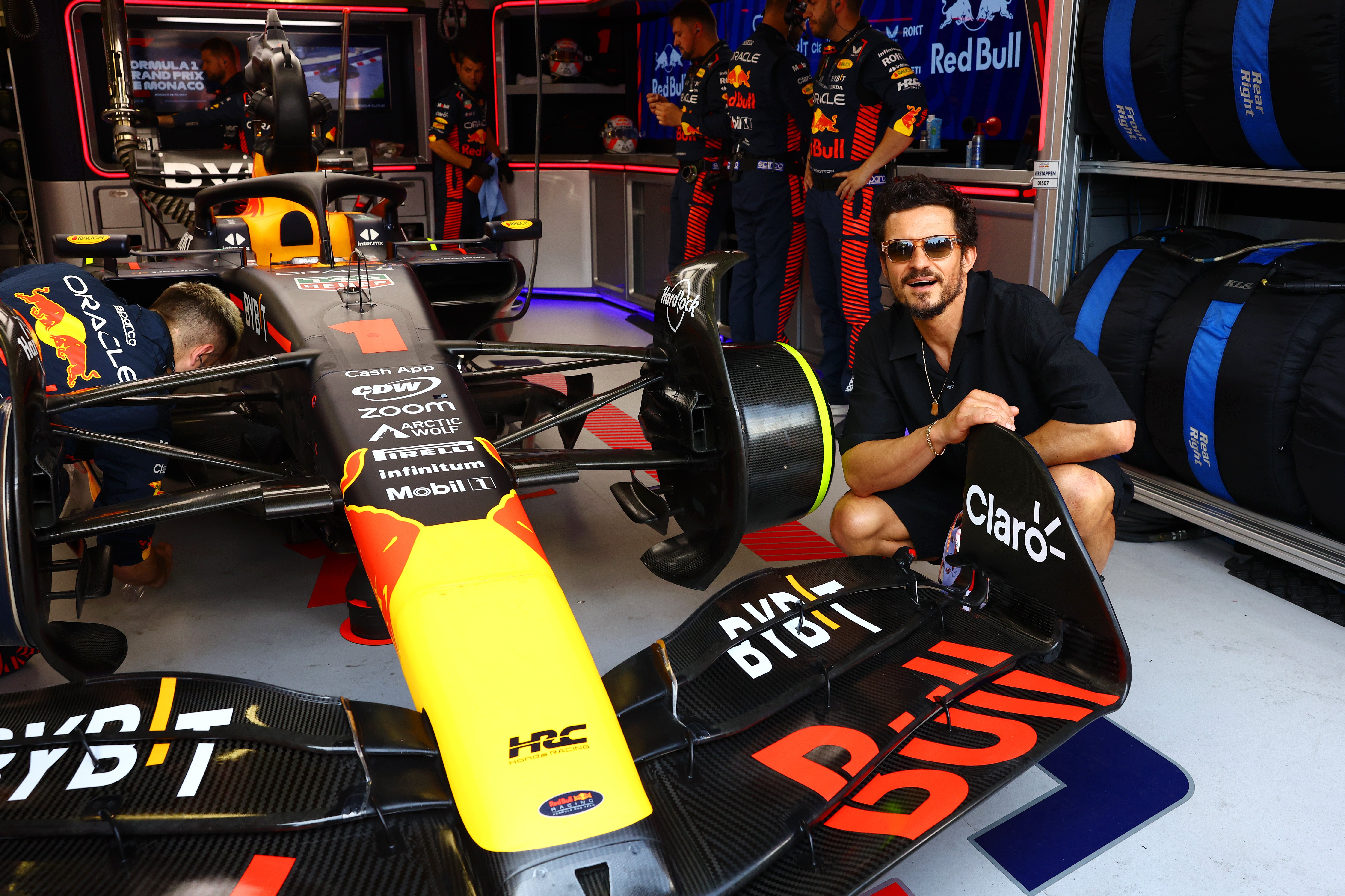 Orlando Bloom poses for a photo in the Red Bull Racing garage prior to the F1 Grand Prix of Monaco at Circuit de Monaco on May 28, 2023