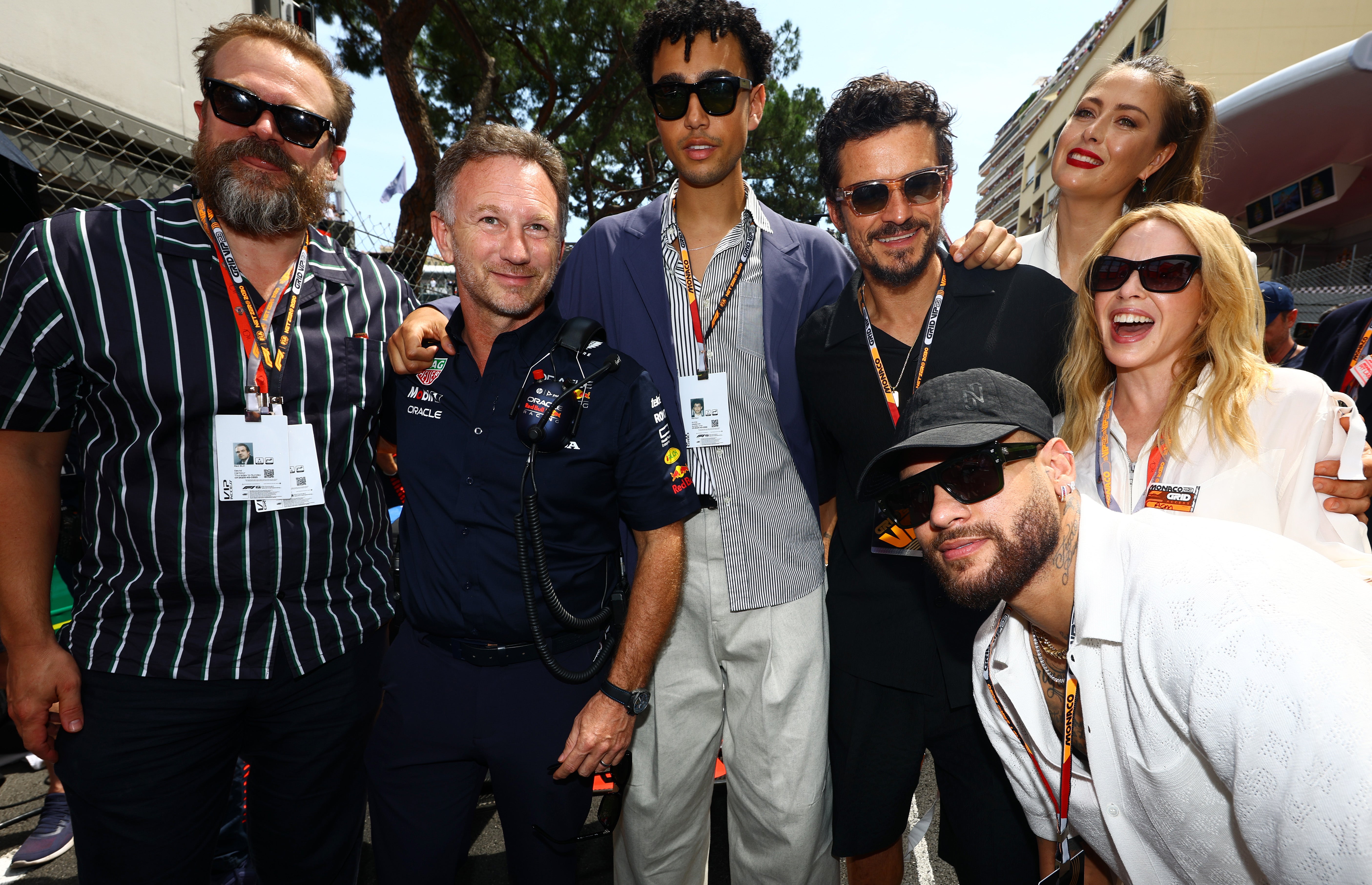 (L-R) David Harbour, Red Bull Racing Team Principal Christian Horner, Archie Madekwe, Orlando Bloom, Neymar, Maria Sharapova and Kylie Minogue pose for a photo on the grid during the F1 Grand Prix of Monaco at Circuit de Monaco on May 28, 2023