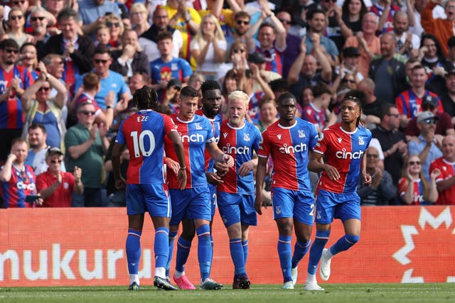 Will Hughes (centre) celebrates with team-mates after scoring Palace’s equaliser (Steven Paston/PA)