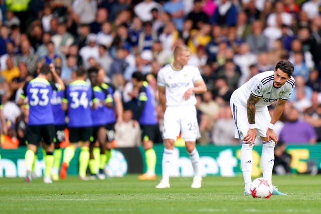 Leeds players look dejected after Spurs’ third goal (Tim Goode/PA)