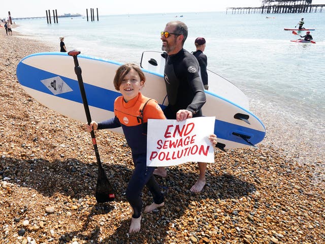 <p>Surfers Against Sewage protested on Brighton Beach on 20 May </p>