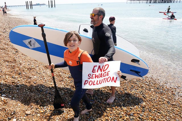 <p>Surfers Against Sewage protested on Brighton Beach on 20 May </p>