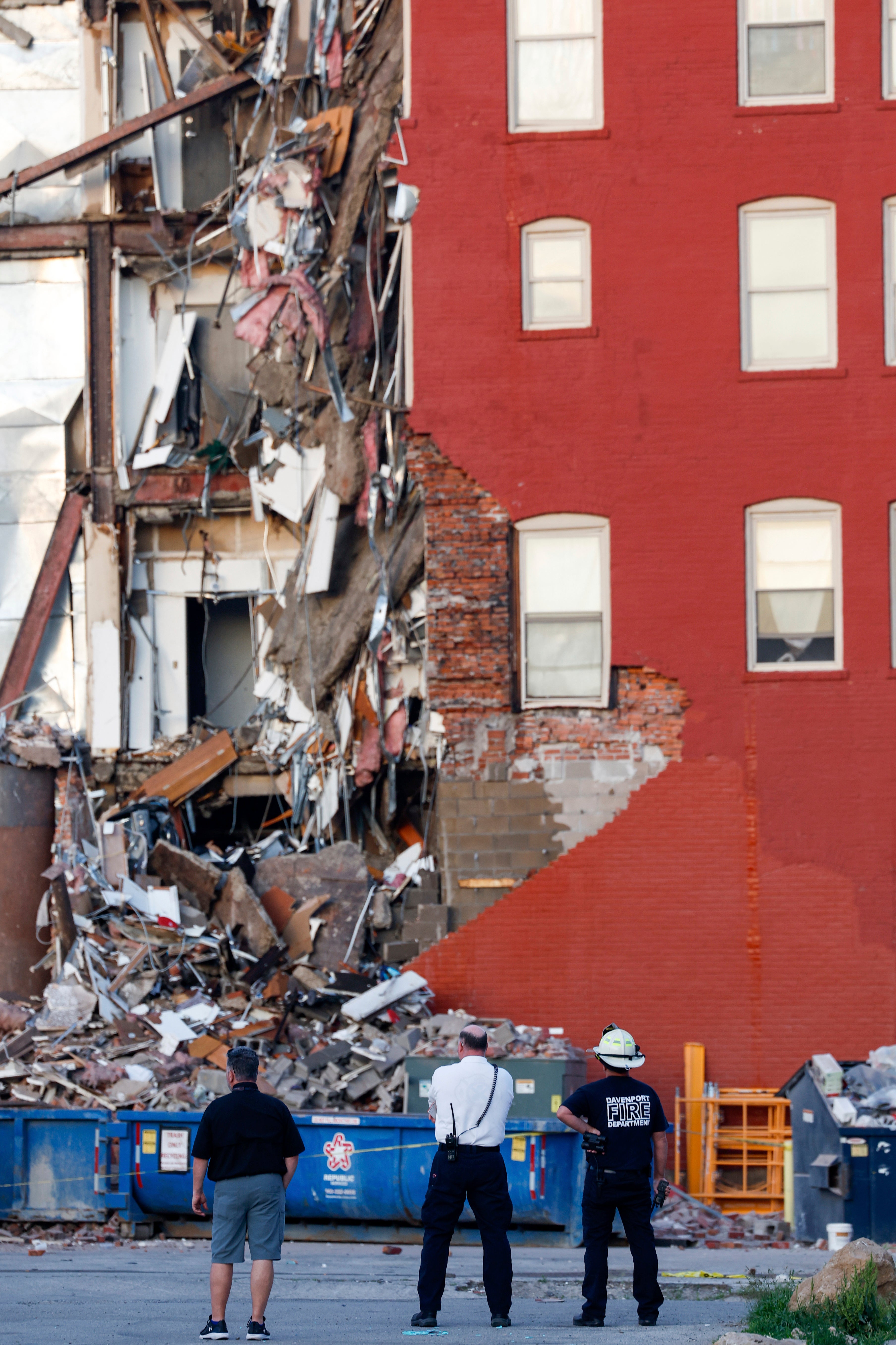The facade of the red brick building was ripped off, exposing the apartment units inside