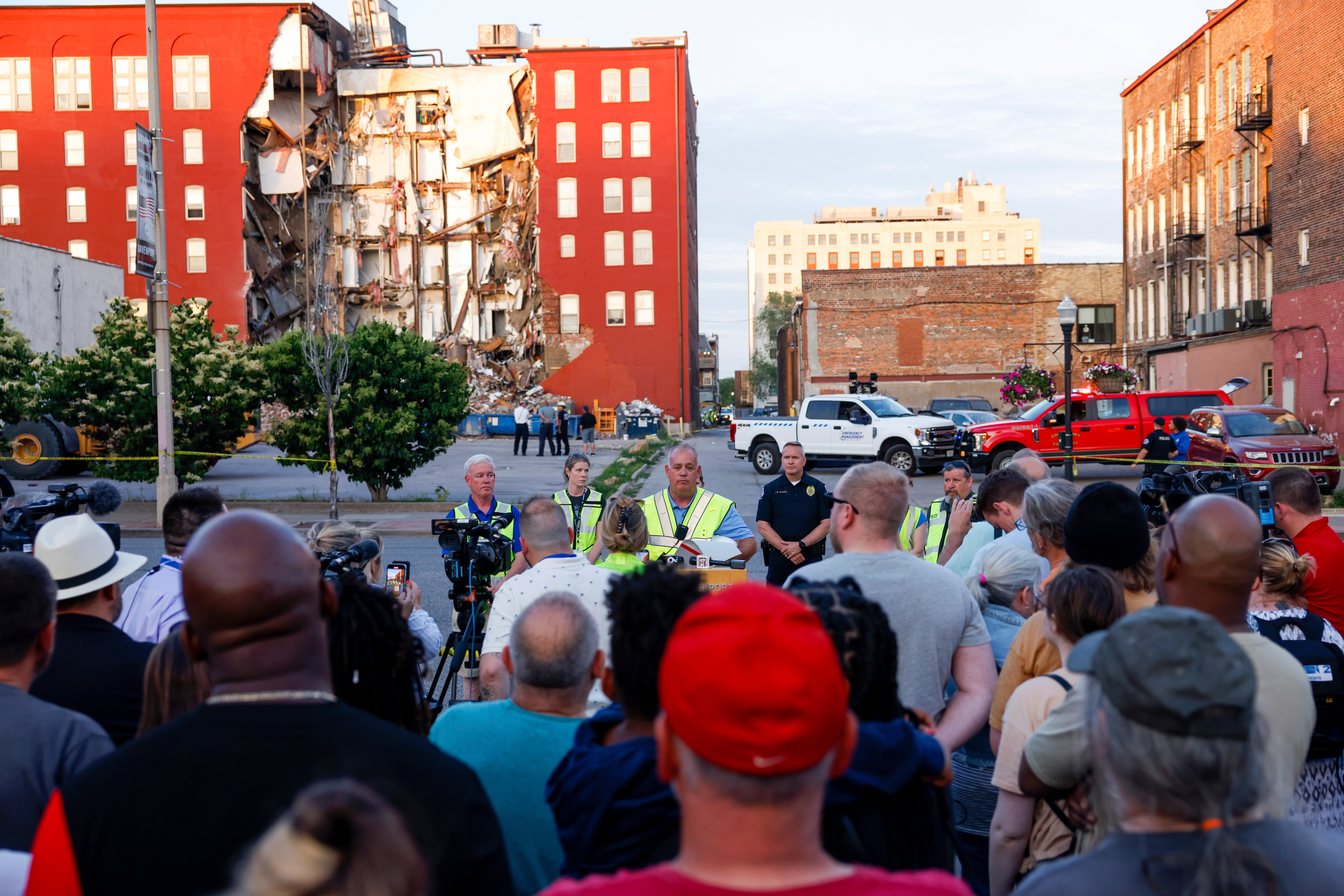 Davenport residents listen to an official update on the building collapse on Monday morning