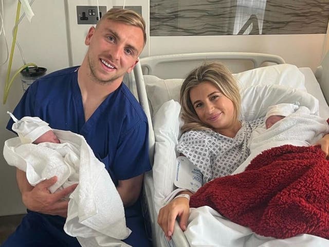 <p>Dani Dyer and Jarrod Bowen hold their newborn twin daughters</p>