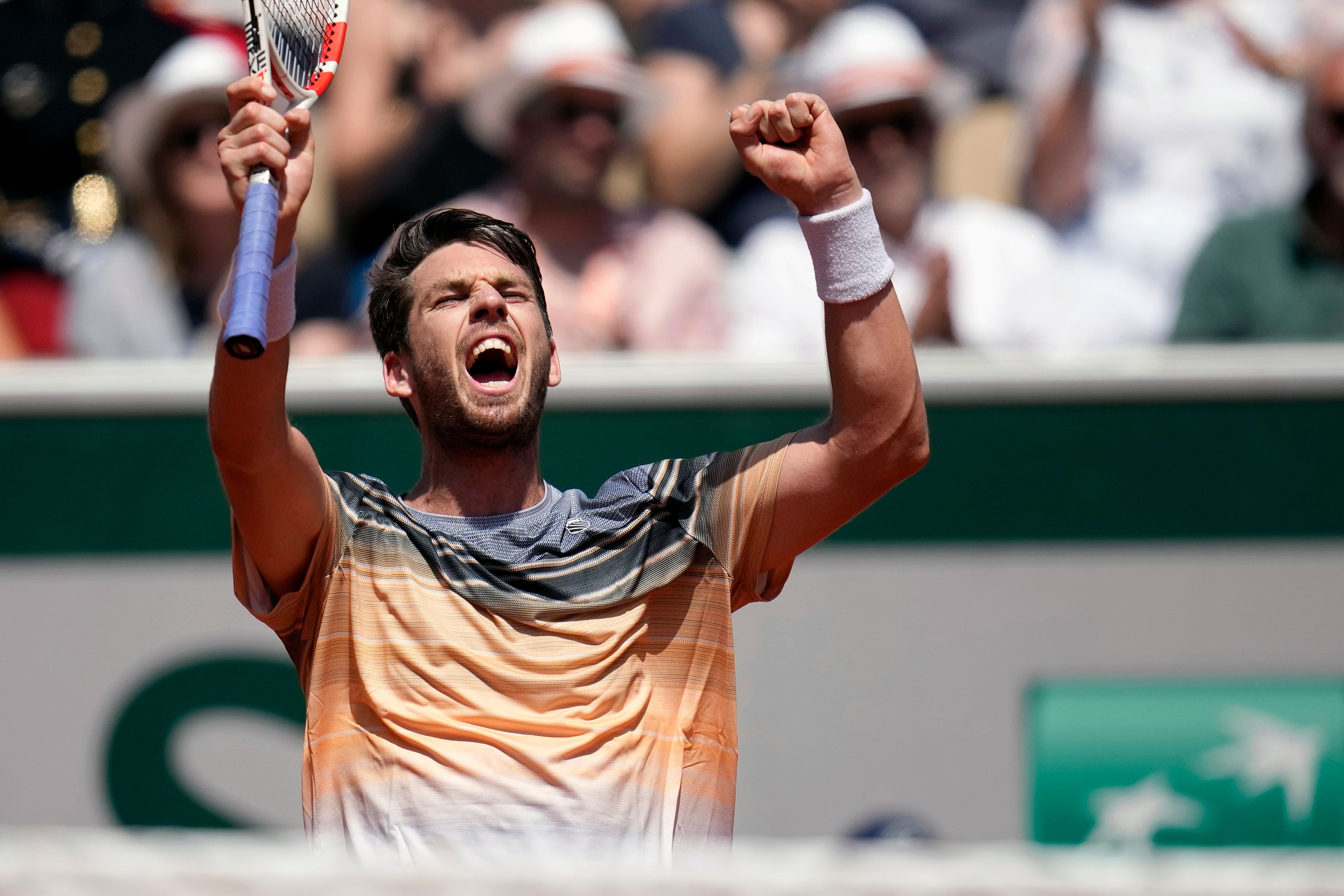 Cameron Norrie celebrates beating Benoit Paire (Christophe Ena/AP)