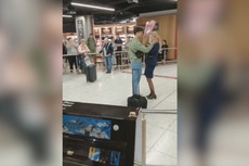 Moment man proposes to Ryanair flight attendant in front of cheering airport crowd