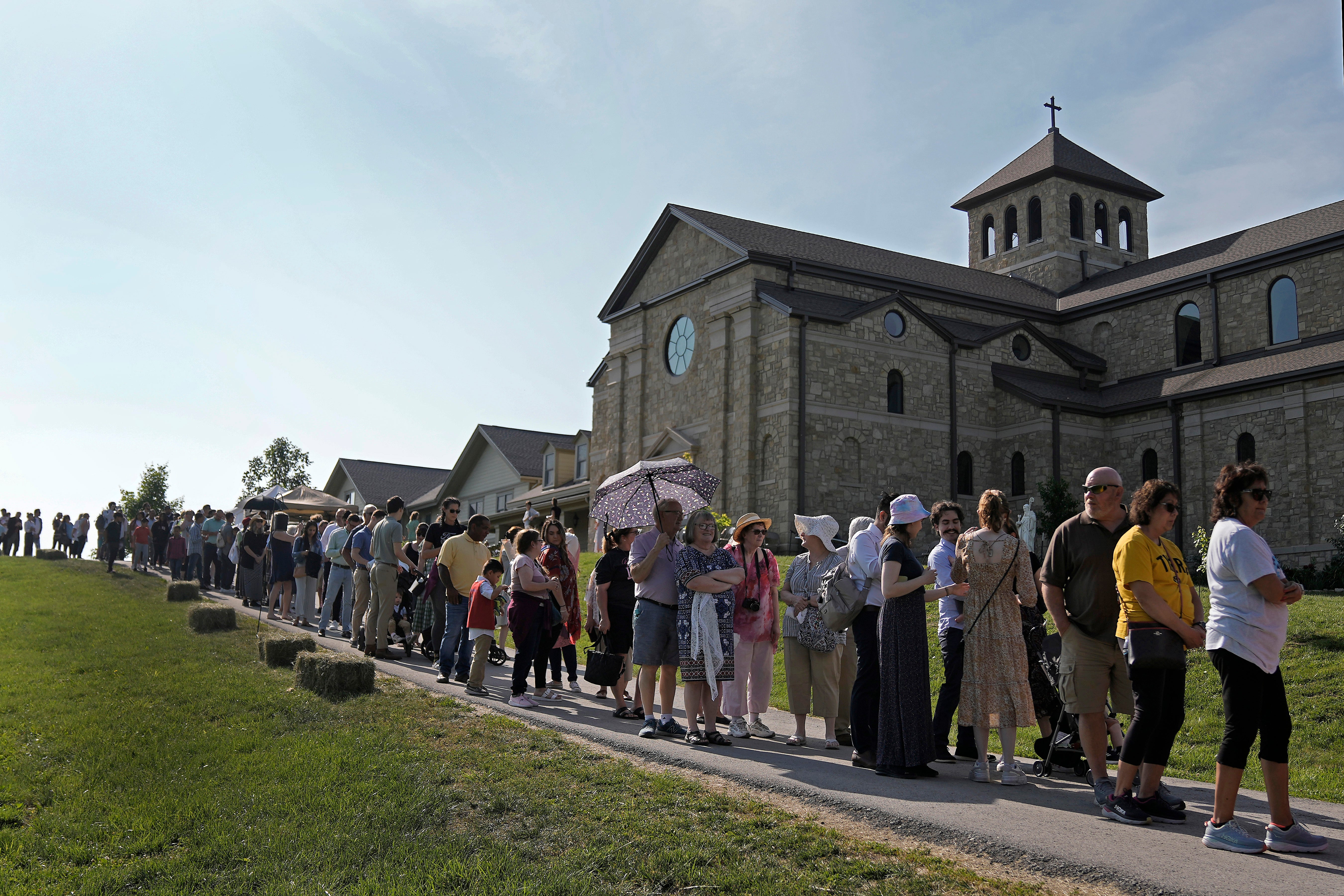 People wait to view the body of Sister Wilhelmina Lancaster at the Benedictines of Mary, Queen of Apostles abbey Sunday, May 28, 2023, near Gower, Mo.Hundreds of people visited the small town in Missouri this week to see the nun's body that has barely decomposed since 2019 â some are saying it's a sign of holiness in Catholicism, while others are saying the lack of decomposition may not be as rare as people think. (AP Photo/Charlie Riedel)