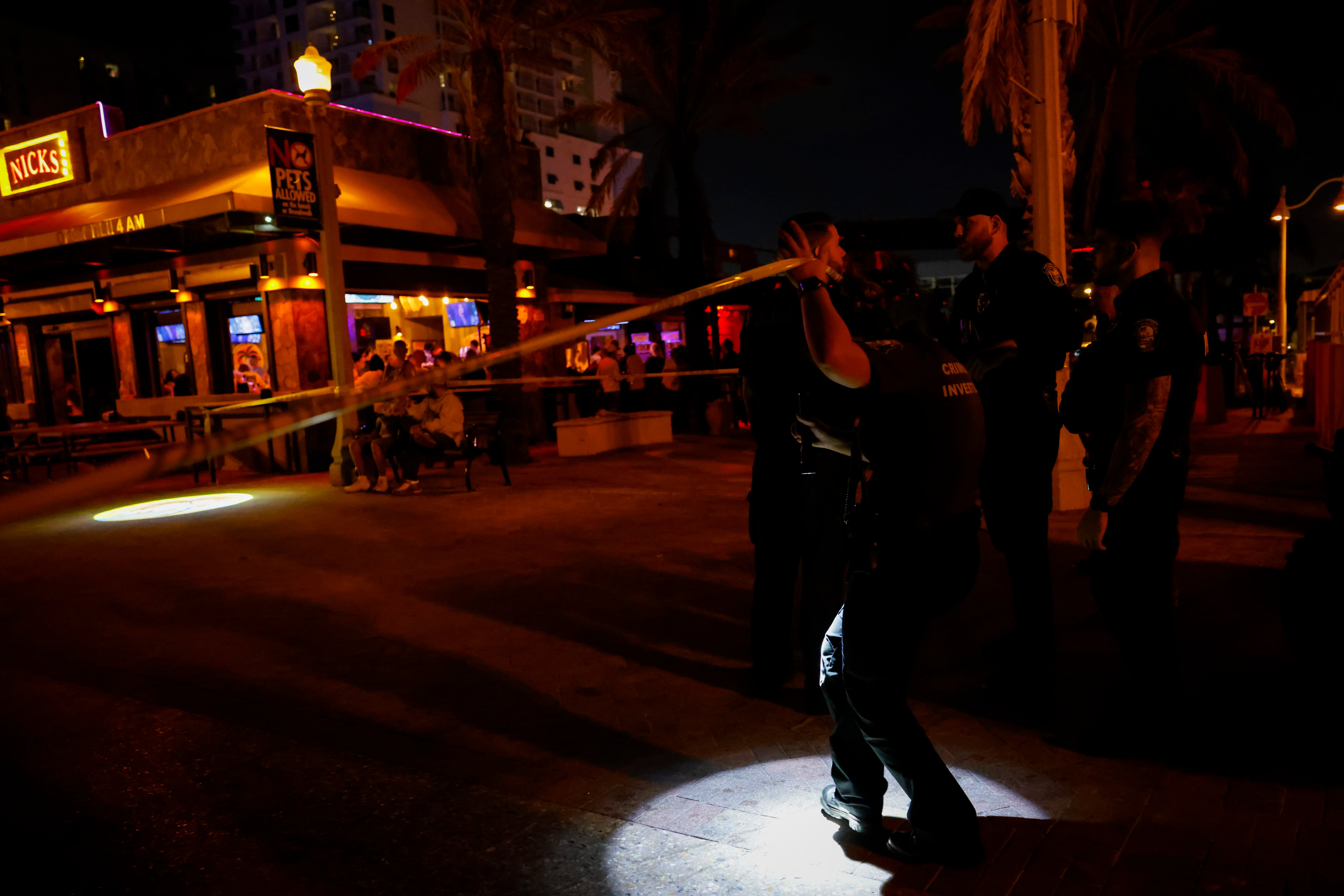 <p>Law enforcement officers are seen on a crime scene as they respond to a shooting at Hollywood Beach on 29 May 2023 in Hollywood, Florida</p>