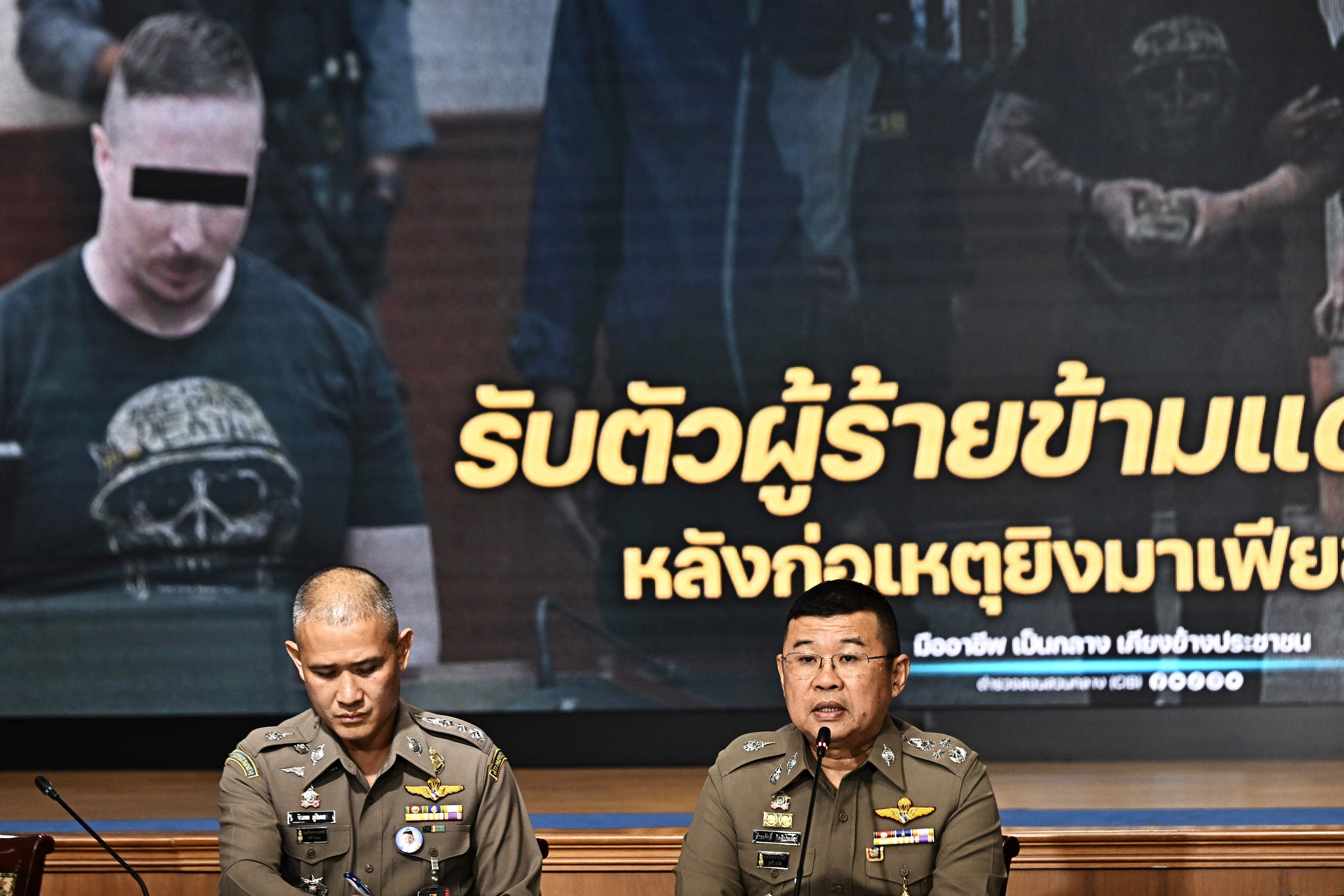 National police chief Damrongsak Kittiprapas (right) speaks during a press conference regarding the extradition of Matthew Dupre (on screen), a Canadian man wanted over the suspected murder of gangster Jimi ‘Slice’ Sandhu in Phuket on 4 February 2022, at the Crime Suppression Division in Bangkok, Thailand on 29 May 2023