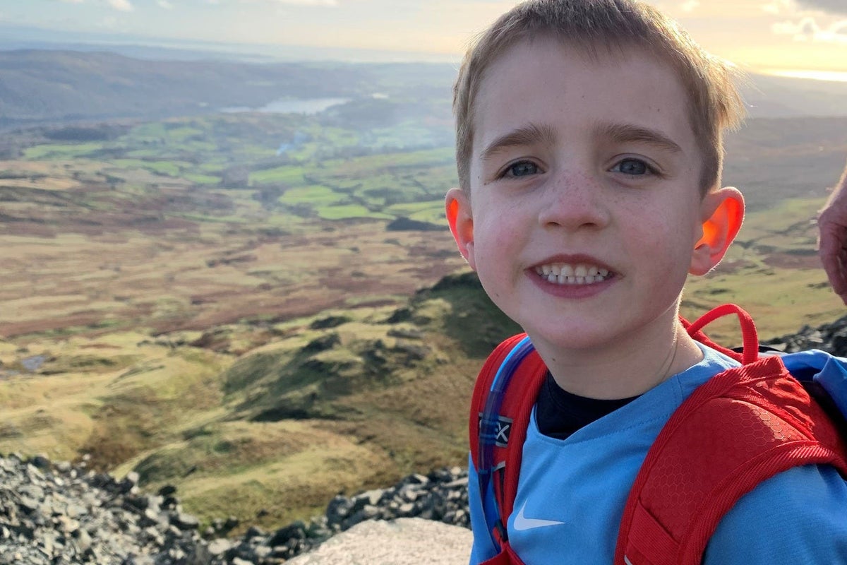 Boy, six, climbs 12 UK mountains ‘to help poorly children go on holiday’