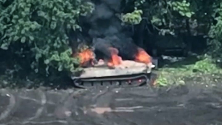 Russian soldiers flee after tank struck by Ukrainian drone