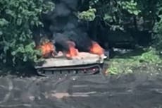 Russian soldiers flee after tank struck by Ukrainian drone