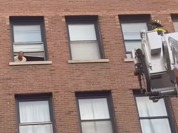 Firefighters are seen rescuing Lisa Brooks from the Iowa building collapse