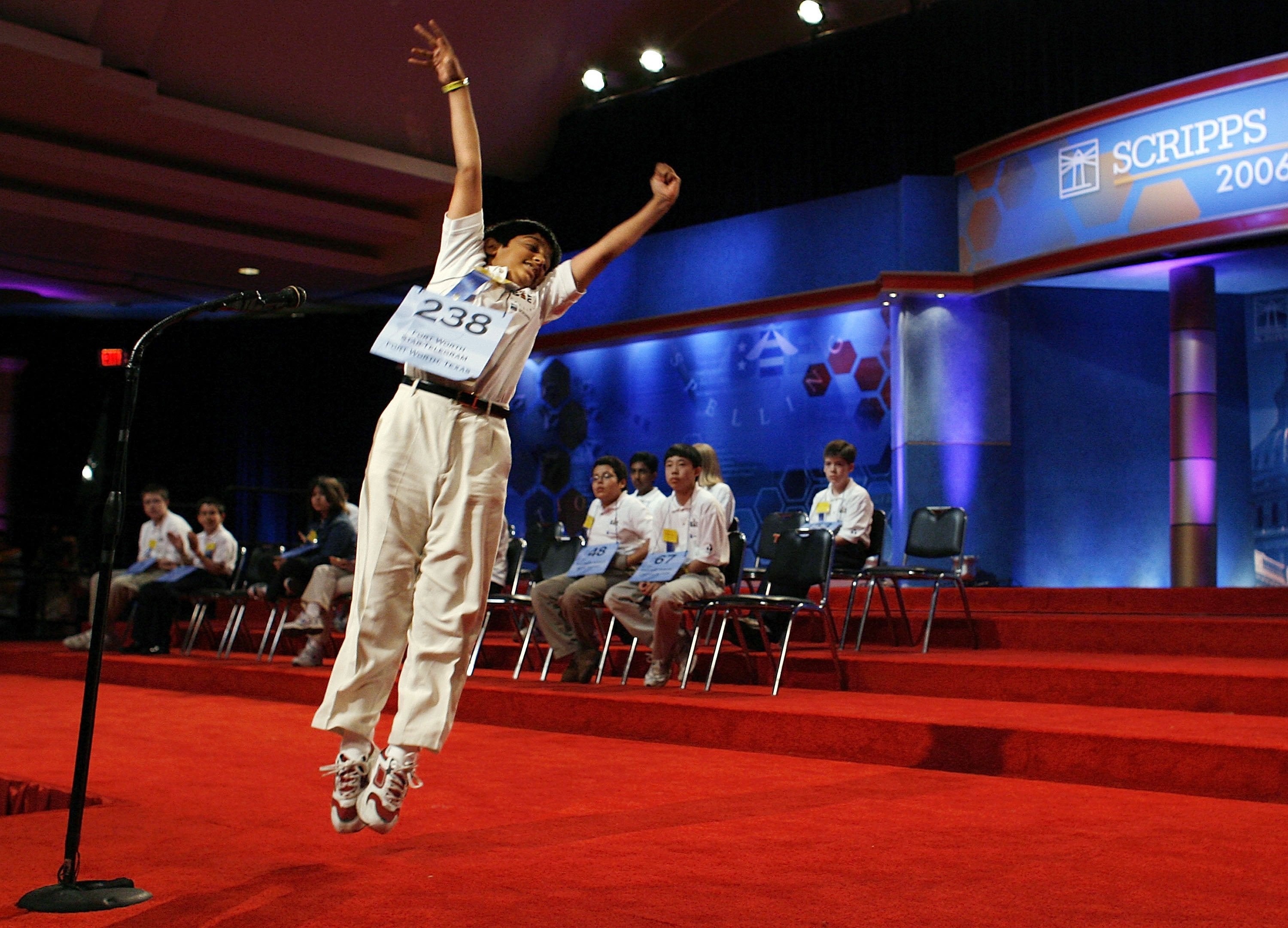 12-year-old Samir Sudhir Patel of Colleyville, Texas, leaps into the air after spelling a word correctly at the 2006 Scripps National Spelling Bee