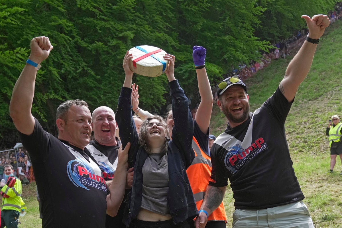 Woman wins famous UK cheese rolling race despite being knocked unconscious